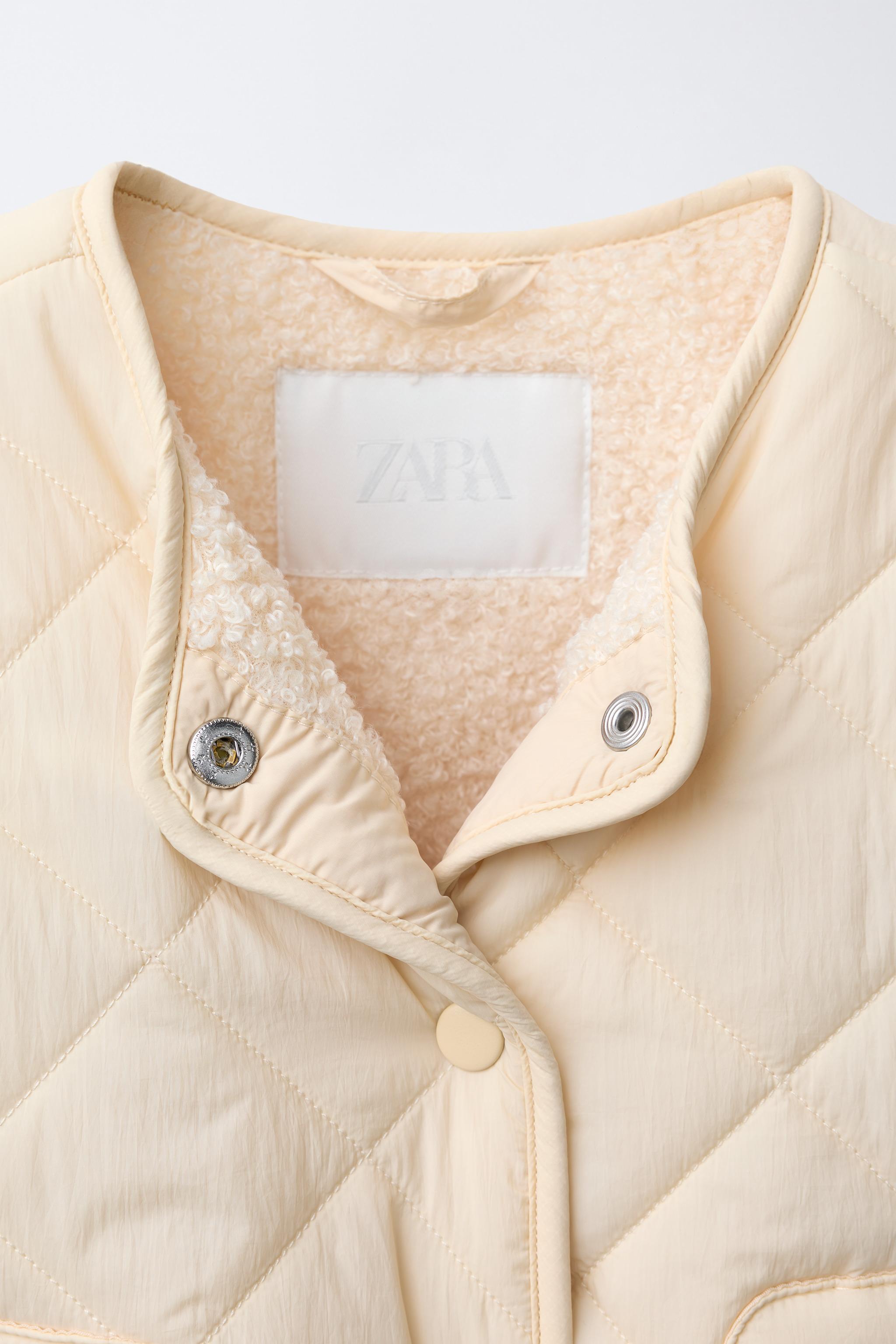 WATER REPELLENT NYLON FAUX SHEARLING JACKET